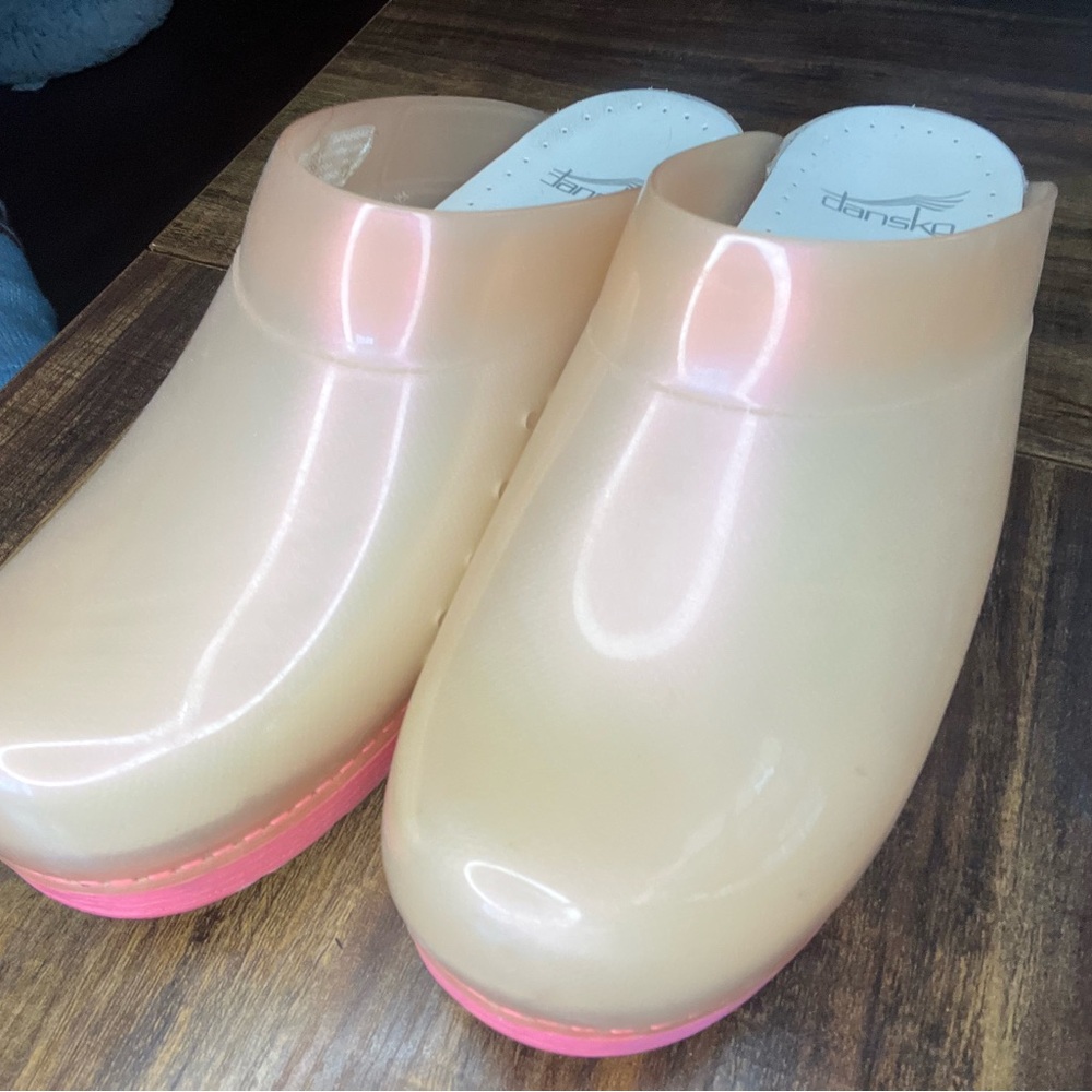 Dansko slip on clogs… transparent pink with pink base.